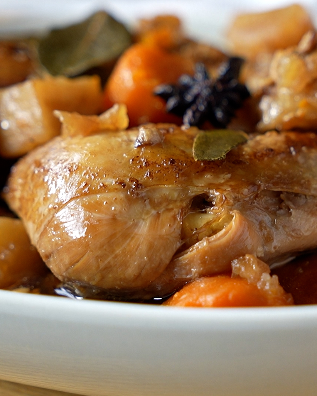Braised chicken with potatoes and carrots served with steamed white rice