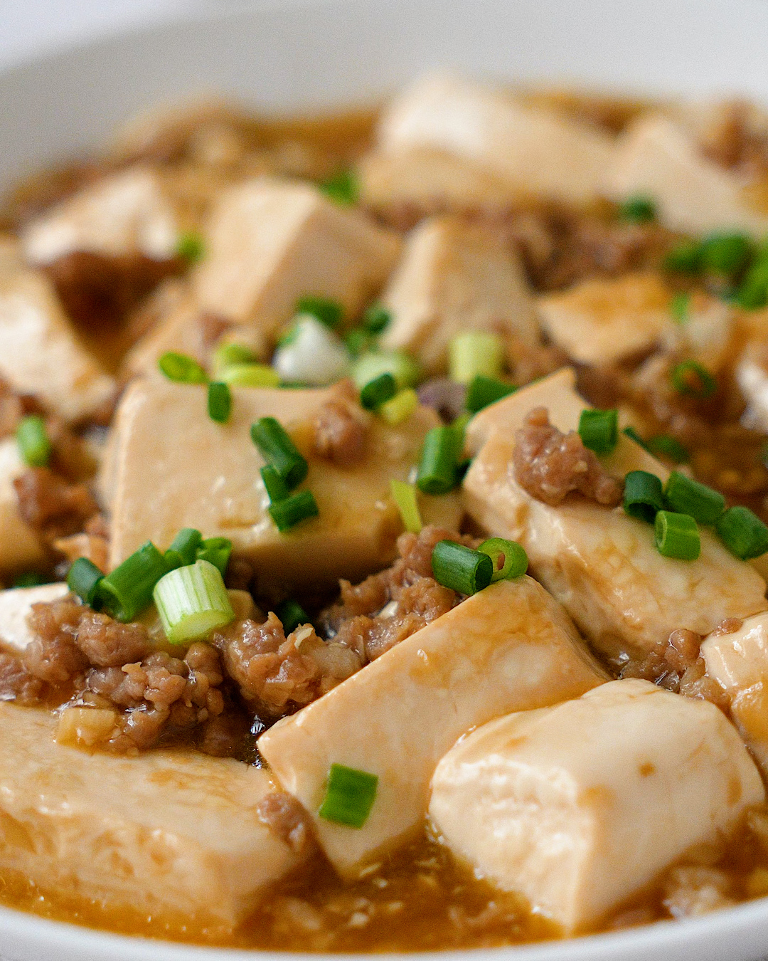 Cutting silken tofu into cubes for the minced pork tofu recipe