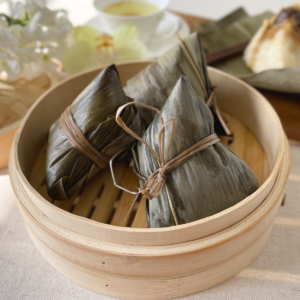 Grandma's white Hokkien bak chang — sticky rice dumplings with pork belly, mushrooms, chestnuts, salted egg and mung beans wrapped in bamboo leaves