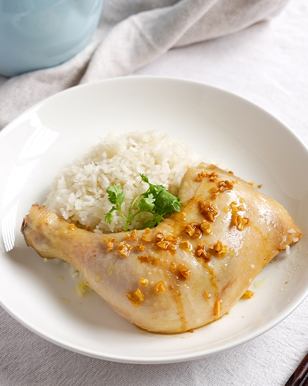 Chicken rice cooked in a rice cooker, served with garlic oil and light soy sauce - Ruyi Asian Recipes