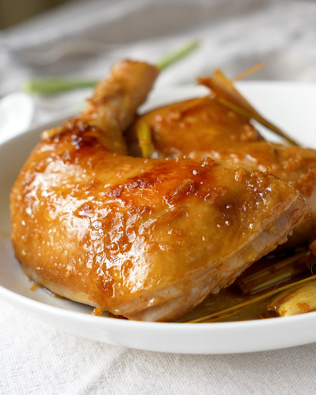 Lemongrass chicken ingredients laid out including lemongrass stalks, garlic, ginger and lime — rice cooker recipe