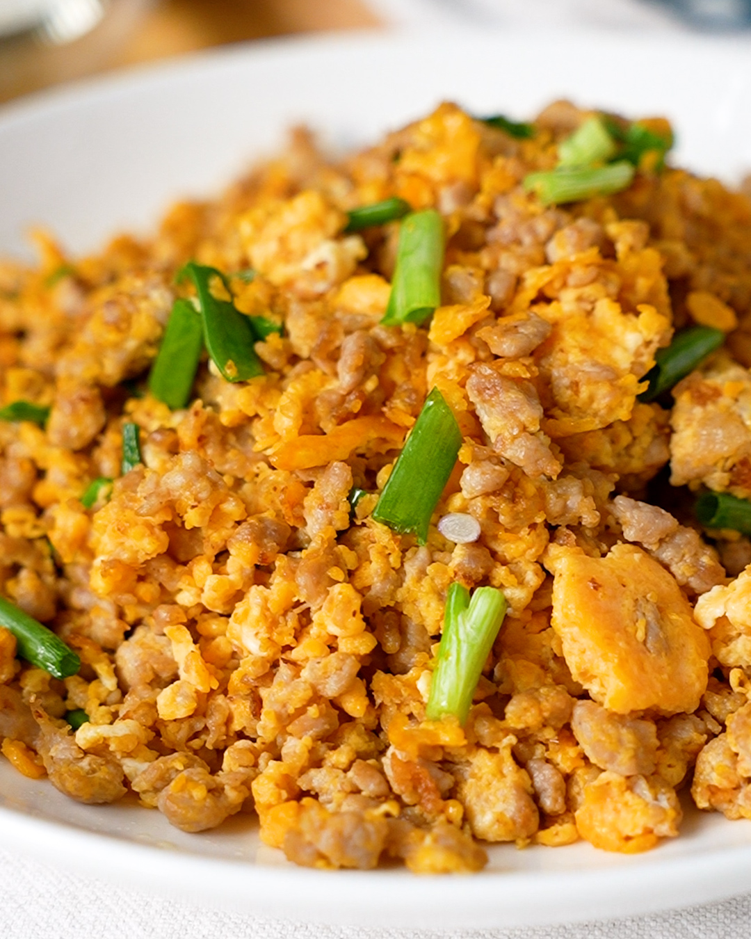 Minced pork and egg stir fry ingredients laid out — minced pork, eggs, spring onion