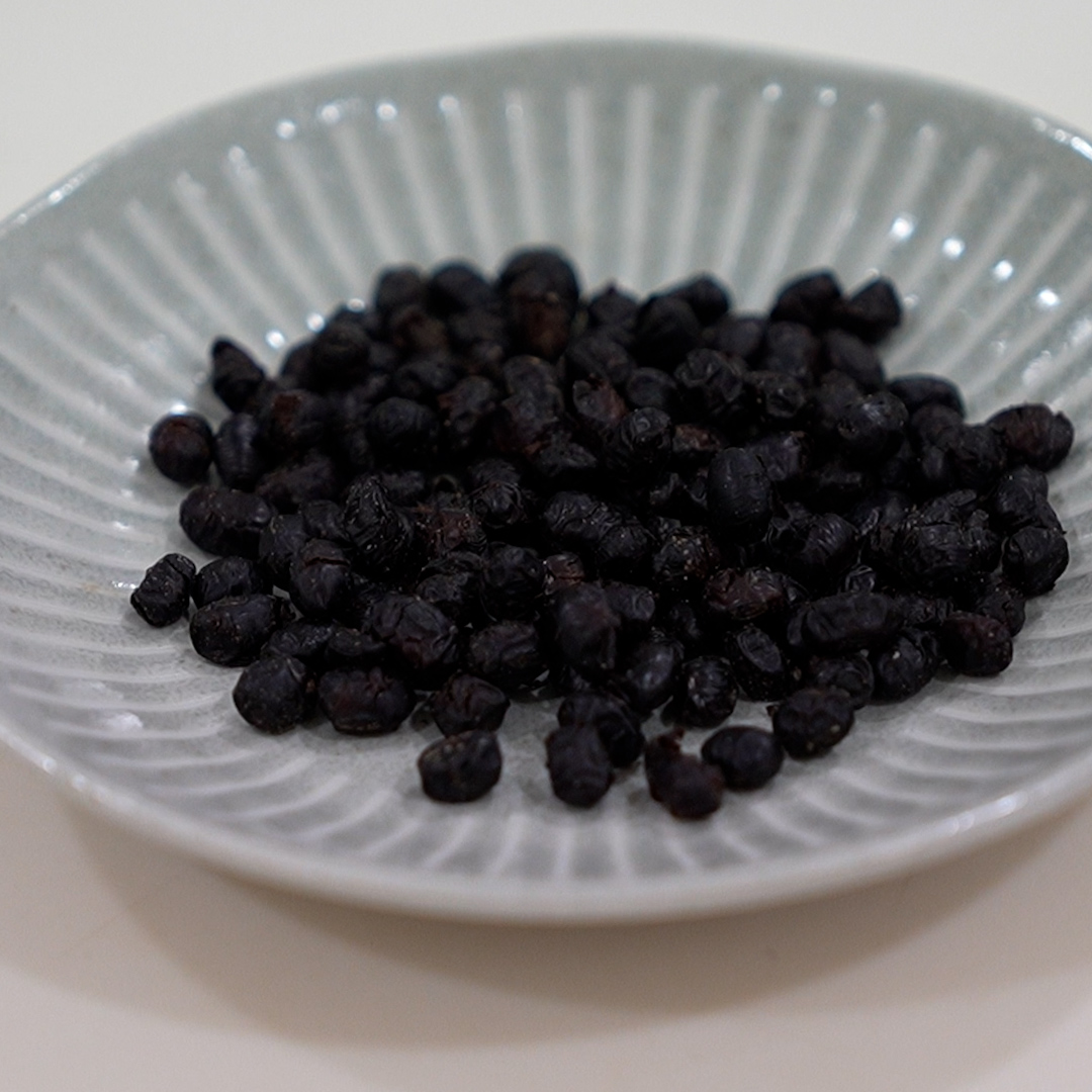 Fermented black beans on a plate front view salted dried black beans for Chinese steamed pork ribs