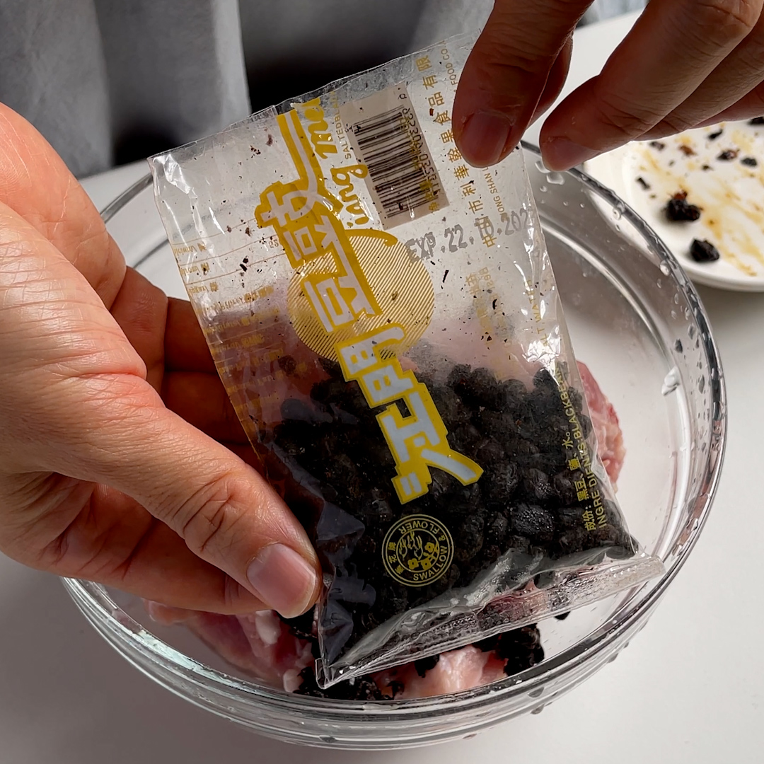 Packet of dried fermented black beans used in steamed pork ribs with fermented black beans recipe