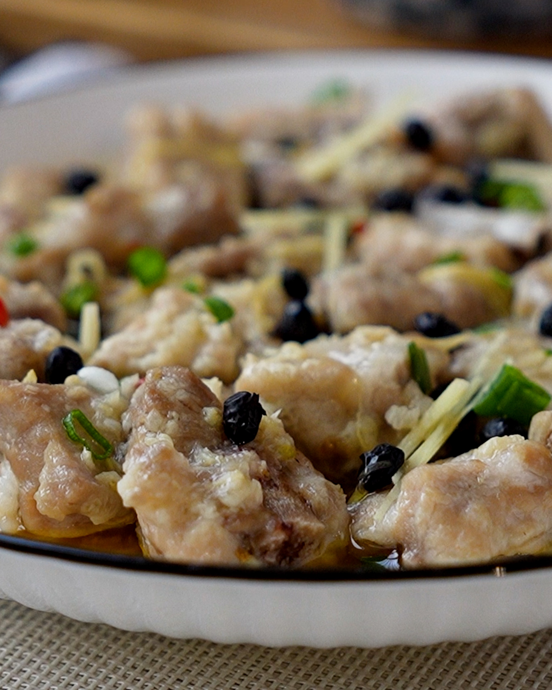 Close-up of tender juicy steamed pork ribs with fermented black beans showing the texture