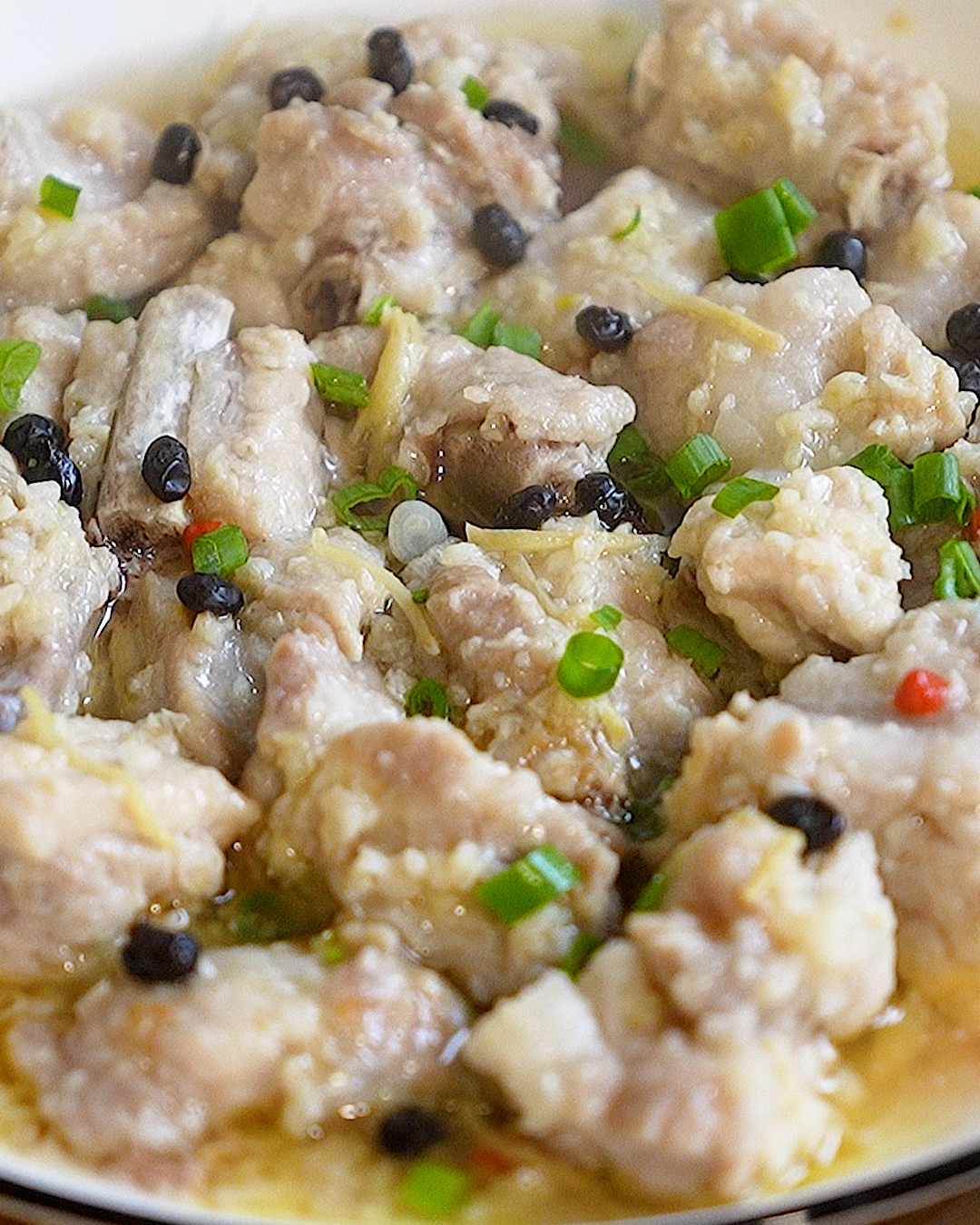 Steamed pork ribs with fermented black beans recipe plated and ready to serve with rice