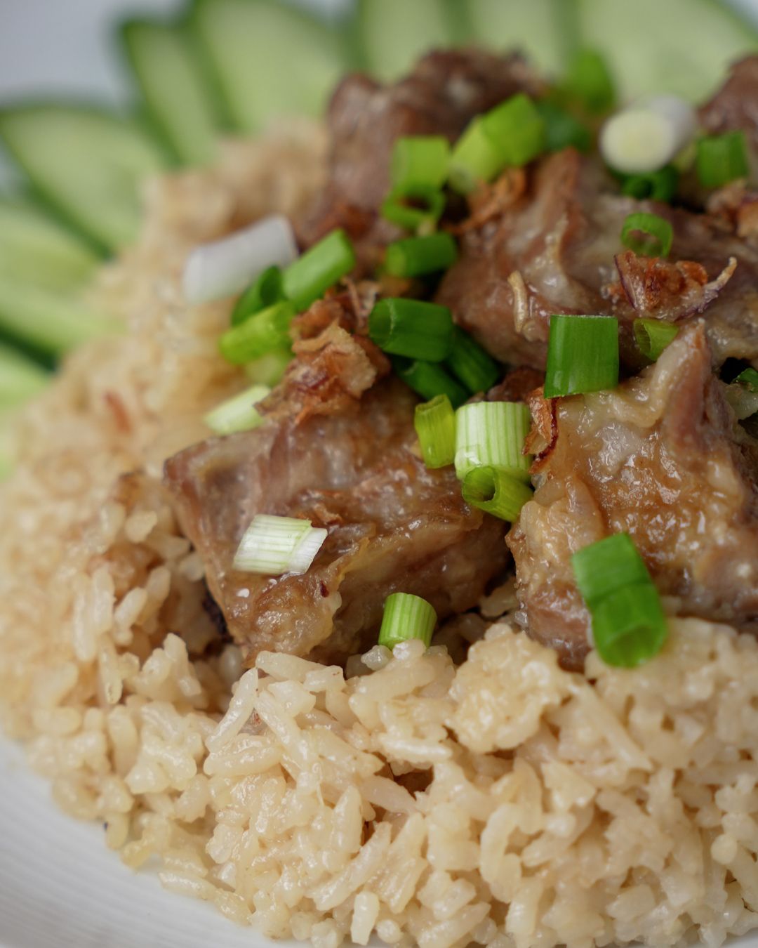 Pork ribs rice topped with spring onions and fried shallots