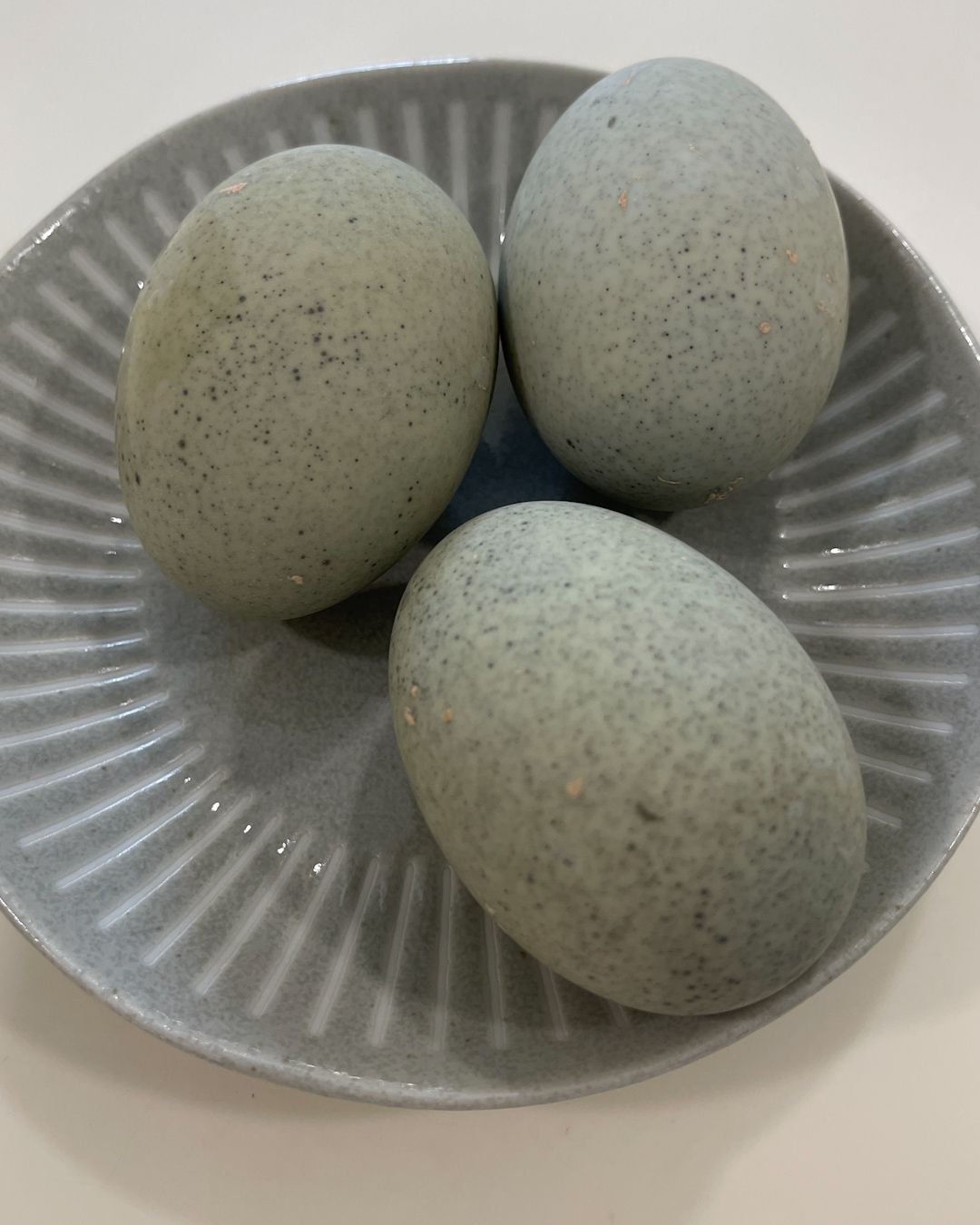 Shelled century eggs showing their distinctive speckled dark shell