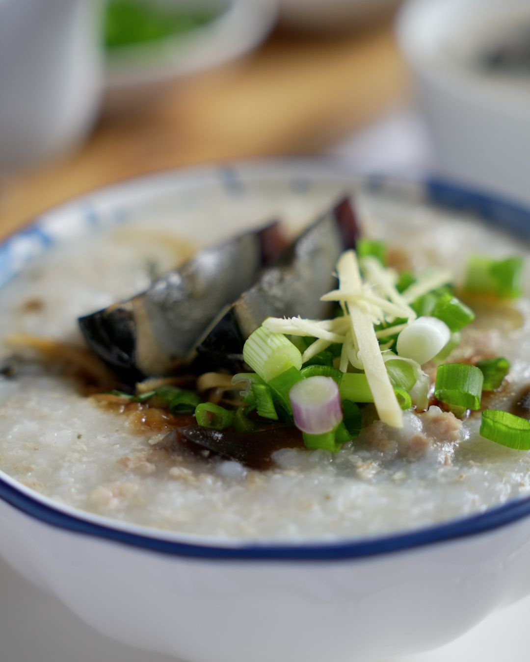 Ingredients for minced pork century egg porridge including century eggs and marinated minced pork