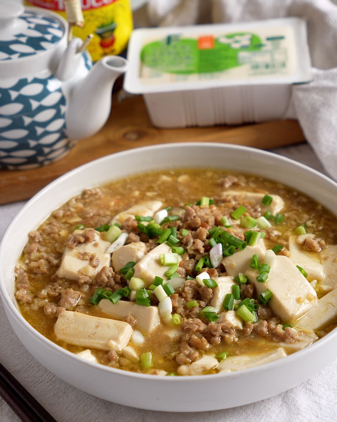 Silken tofu with minced pork and bean paste served in a bowl, Chinese taucu tofu recipe