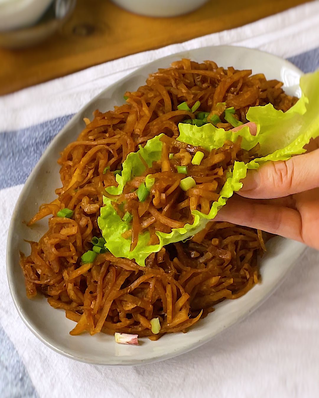 Jicama strips cooked with dried shrimp and dark soy sauce in a wok